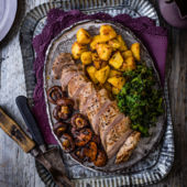 Roast pork with balsamic mushrooms, crispy potatoes & kale