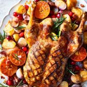 Sticky citrus roast duck with crispy potatoes