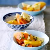 Tropical fruit salad with mint and passion syrup