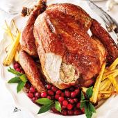 Roast turkey with spiced cranberry-pecan stuffing and maple glaze 