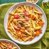 Burst tomato, caramelised onion and tahini pasta