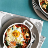 Baked eggs with spicy peppers, spinach and feta