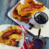 Bacon pancakes with maple syrup and blueberries 