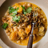 Chicken, pumpkin and chickpea korma with crispy shallots