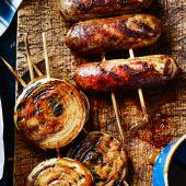 Sticky glazed sausages and onion rings