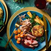 Roast and confit duck with bubble and squeak cakes, cranberry gravy