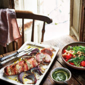 Stuffed roast pork fillet with cannellini bean and tomato salad