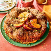 Peach and pistachio croissant cake