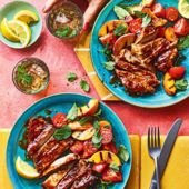 Bourbon-glazed pork chops with grilled peach and tomato salad