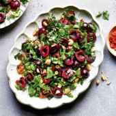 Fresh herb salad with cherries and almonds