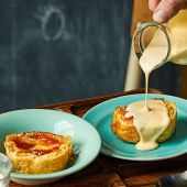 Apricot jam roly-poly with cardamom and vanilla custard