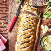 Pork and stout sausage roll with mustard dip  