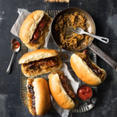 Sausages with beer-braised onions