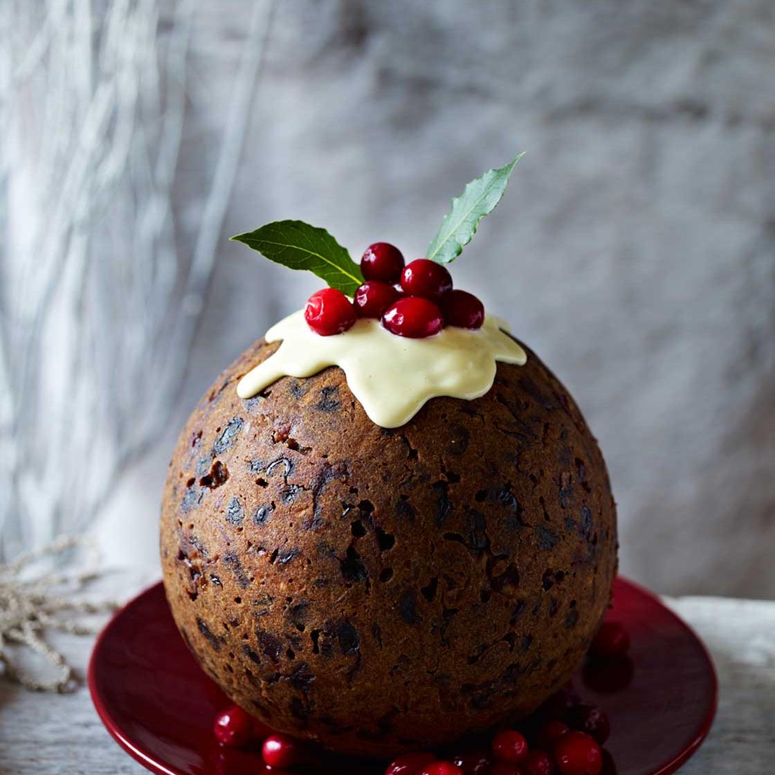 Cranberry gingerbread Christmas pudding with ginger sauce