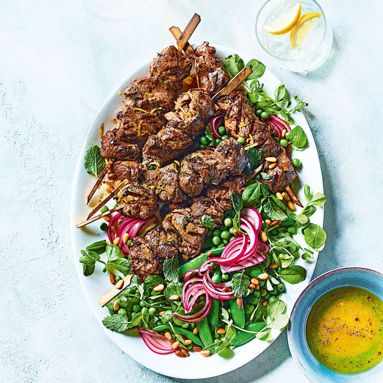 Lamb kebabs with summer pea salad