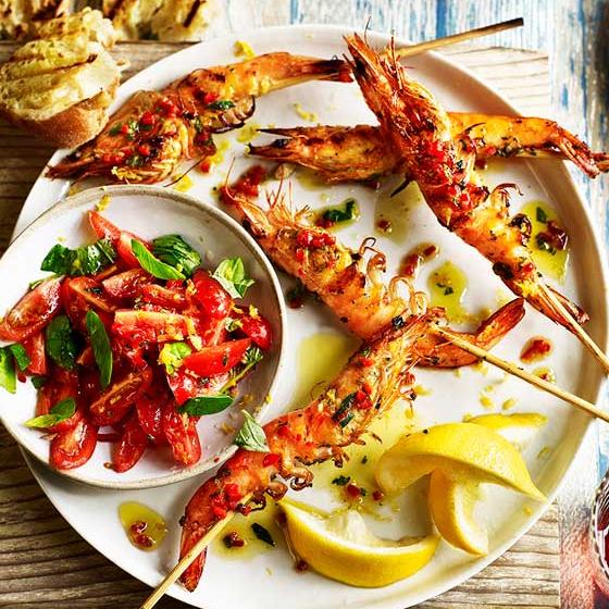Lemony prawn skewers with tomato chilli and oregano