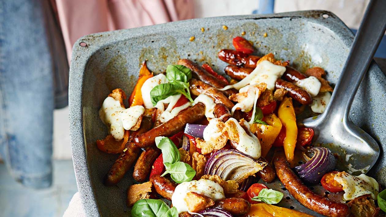 image of Melting Mozzarella, Sausage and Sweet Pepper Traybake recipe by Sainsbury’s Magazine