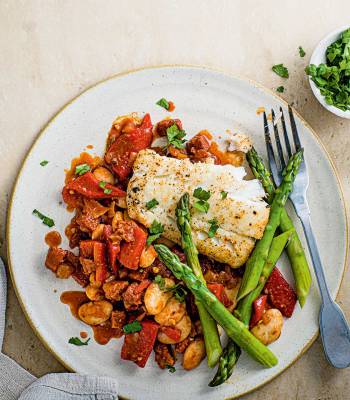 Butter bean, pepper and chorizo sauté with seared cod and asparagus