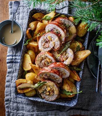 Sage and apricot-stuffed pork tenderloin with roasted pear, parsnip and potato