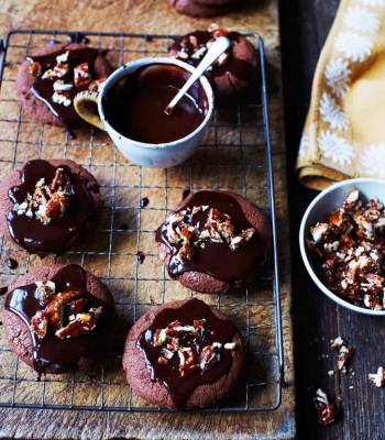 Decadent chocolate cookies with chocolate ganache and candied pecans