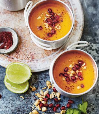 Sweet potato, sumac and pomegranate soup with roasted peanuts, coriander and lime