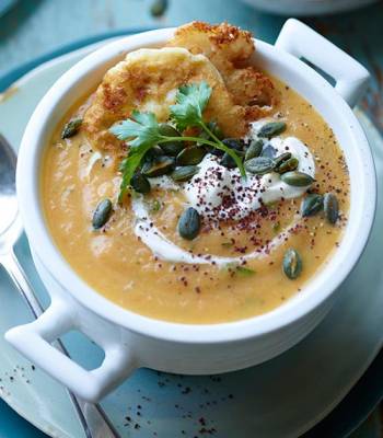 Carrot, ginger and parsley soup with mini feta fritters and pumpkin seeds