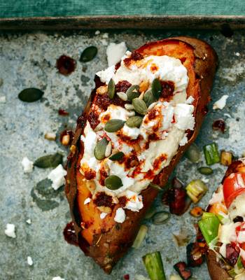 Baked sweet potato with houmous and harissa