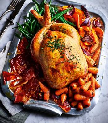 Creamy garlic roast chicken with crispy ham and veggies