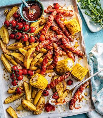 Smoky pigs-in-blankets traybake