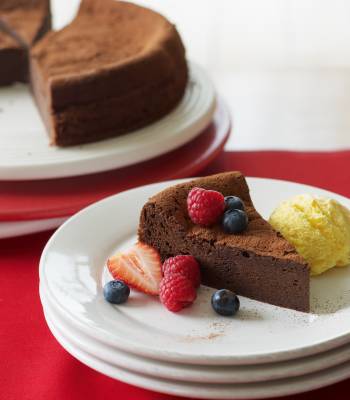 Chocolate brownie cake with berries and ice cream