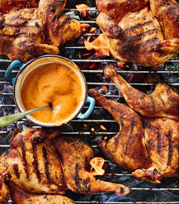 Spiced spatchcock poussins with barbecued peach sauce