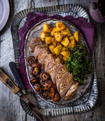 Roast pork with balsamic mushrooms, crispy potatoes & kale