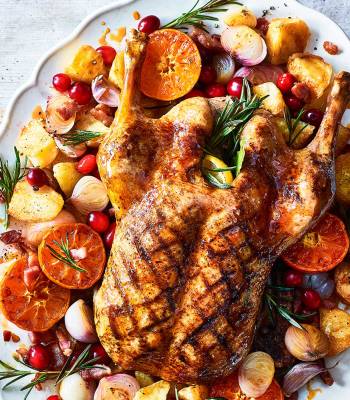 Sticky citrus roast duck with crispy potatoes