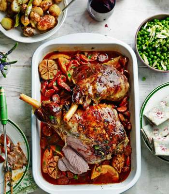 Roast lamb with chorizo, orange and parsley and simple roasties  