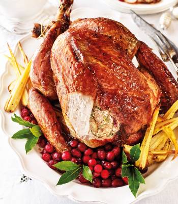 Roast turkey with spiced cranberry-pecan stuffing and maple glaze 