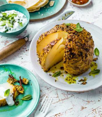 Slow-roast spiced whole celeriac with raita 