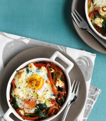 Baked eggs with spicy peppers, spinach and feta