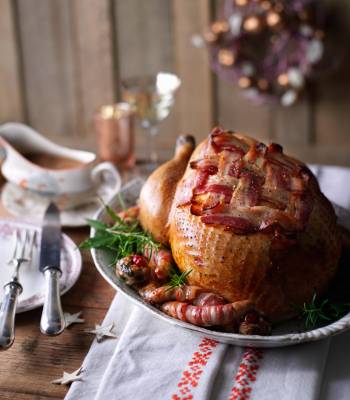 Roast turkey with cranberry stuffing and pigs in blankets
