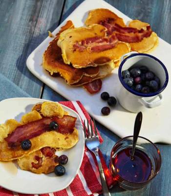 Bacon pancakes with maple syrup and blueberries 