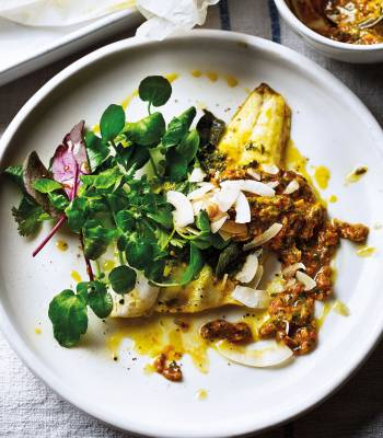 Herb-crusted sea bass with toasted coconut and tomato dressing