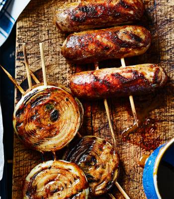 Sticky glazed sausages and onion rings