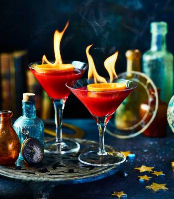 Flaming cranberry & orange cocktail