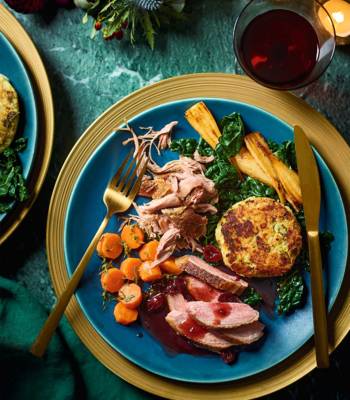 Roast and confit duck with bubble and squeak cakes, cranberry gravy