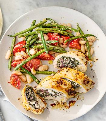 Spinach, cheese and olive stuffed chicken with two-bean salad