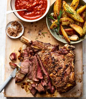 Salt and pepper rib of beef with Bloody Mary sauce and roast potato wedges