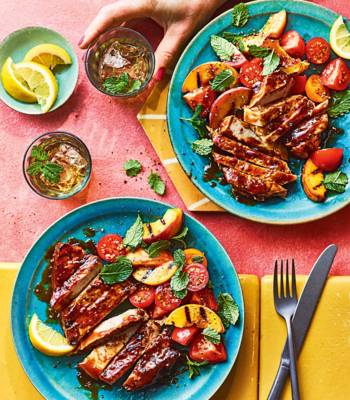 Bourbon-glazed pork chops with grilled peach and tomato salad