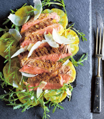 Steak tagliata with yellow tomatoes, oregano and mustard
