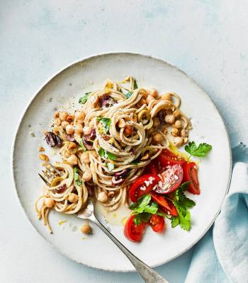 Tahini and olive spaghetti with tomato salad
