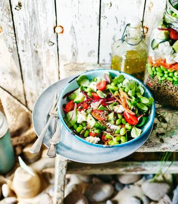 Layered rainbow salad with quinoa and feta