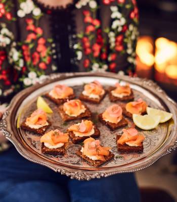 Smoked salmon on rye with quick pickled juniper radishes